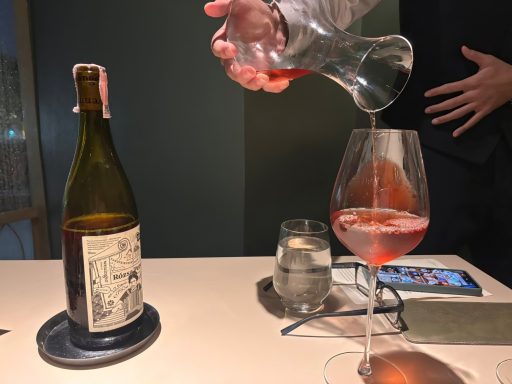 Pouring wine from carafe